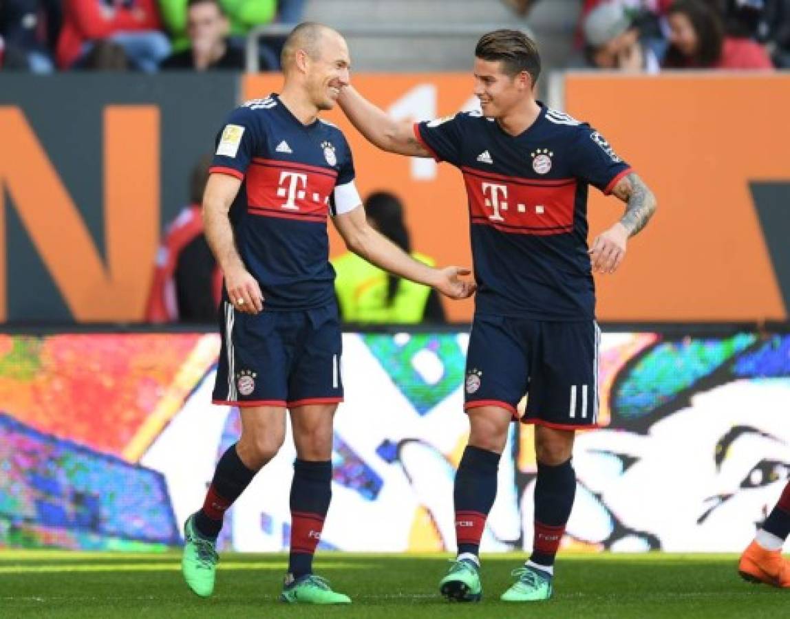 Bayern Munich's Dutch midfielder Arjen Robben (L) and Bayern Munich's Colombian James Rodriguez (R) react after the third goal during the German first division Bundesliga football match FC Augsburg vs FC Bayern Munich in Augsburg, southern Germany, on April 7, 2018. / AFP PHOTO / Christof STACHE / RESTRICTIONS: DURING MATCH TIME: DFL RULES TO LIMIT THE ONLINE USAGE TO 15 PICTURES PER MATCH AND FORBID IMAGE SEQUENCES TO SIMULATE VIDEO. == RESTRICTED TO EDITORIAL USE == FOR FURTHER QUERIES PLEASE CONTACT DFL DIRECTLY AT + 49 69 650050