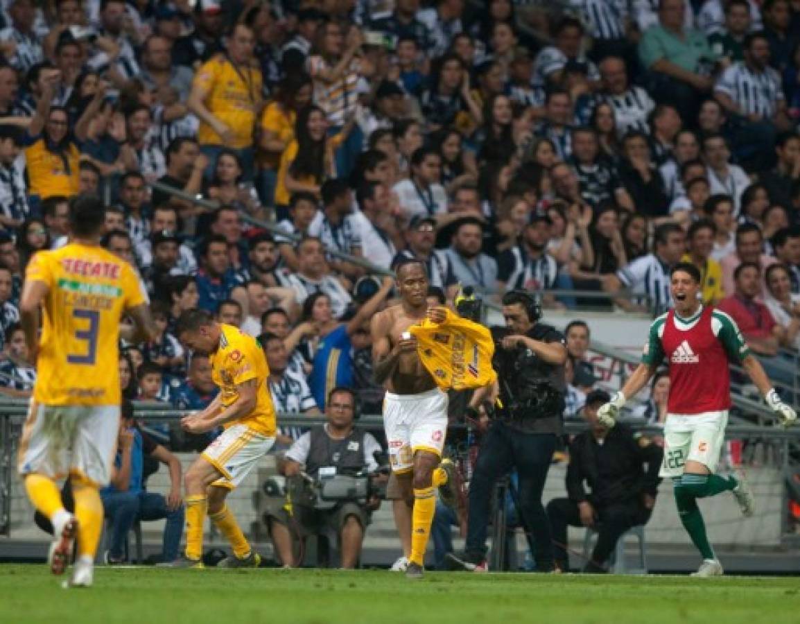 Tigres' Luis Quiones (C) celebrates after scoring against Monterrey during their Mexican Clausura 2019 tournament football, match in Monterrey, Mexico, on March 9, 2019. (Photo by Julio Cesar AGUILAR / AFP)