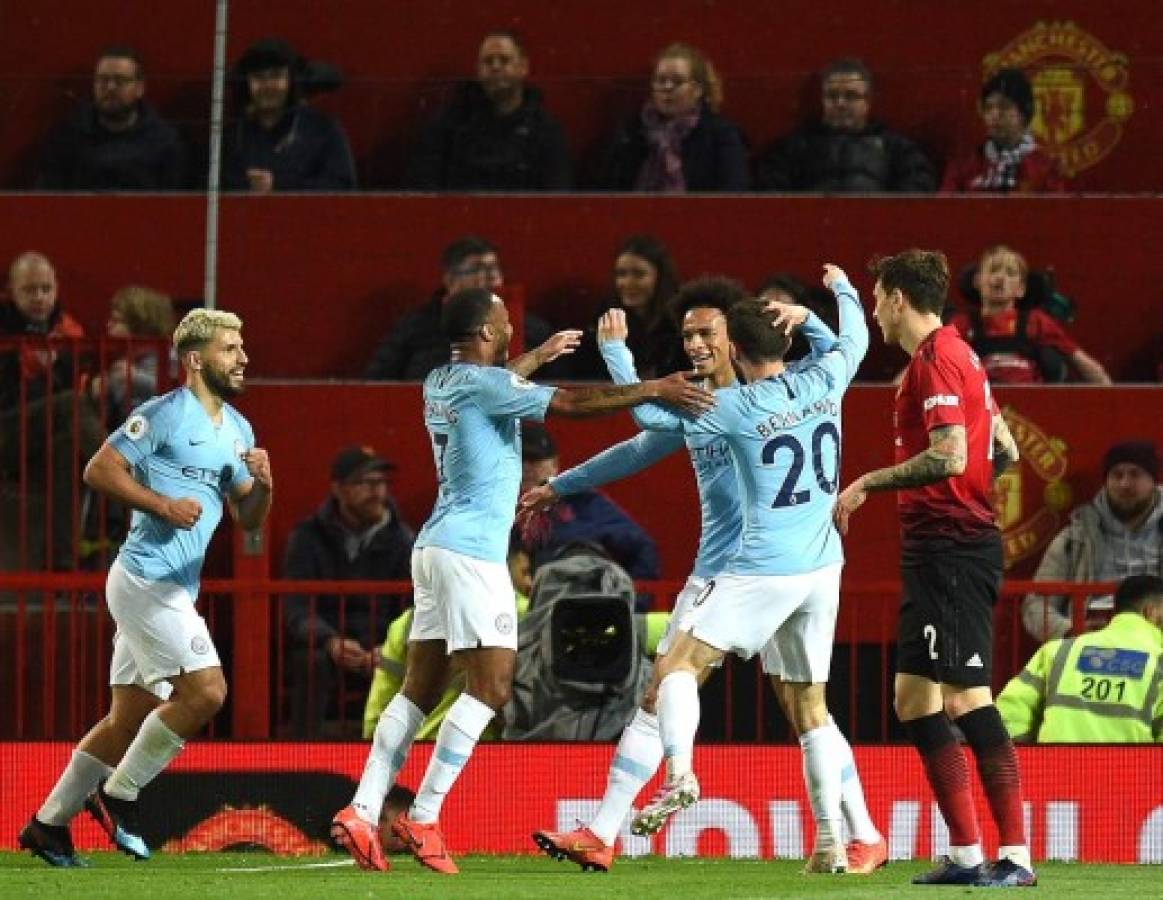 Manchester City's German midfielder Leroy Sane (3R) celebrates scoring his team's second goal during the English Premier League football match between Manchester United and Manchester City at Old Trafford in Manchester, north west England, on April 24, 2019. (Photo by Oli SCARFF / AFP) / RESTRICTED TO EDITORIAL USE. No use with unauthorized audio, video, data, fixture lists, club/league logos or 'live' services. Online in-match use limited to 120 images. An additional 40 images may be used in extra time. No video emulation. Social media in-match use limited to 120 images. An additional 40 images may be used in extra time. No use in betting publications, games or single club/league/player publications. /