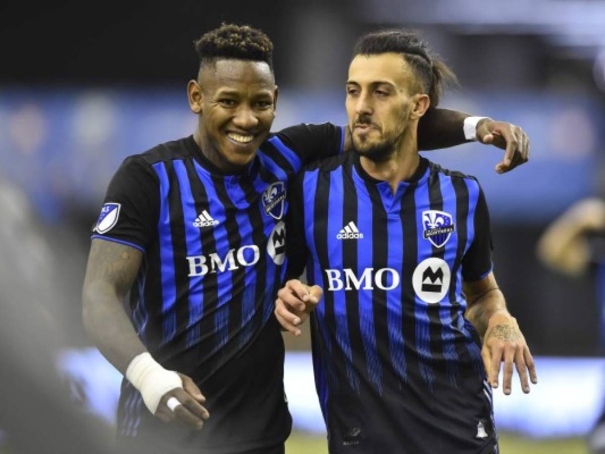 MONTREAL, QC - FEBRUARY 29: Maximiliano Urruti #37 of the Montreal Impact (R) celebrates his goal with teammate Romell Quioto #30 (L) in the second half against New England Revolution during the MLS game at Olympic Stadium on February 29, 2020 in Montreal, Quebec, Canada. The Montreal Impact defeated New England Revolution 2-1. Minas Panagiotakis/Getty Images/AFP