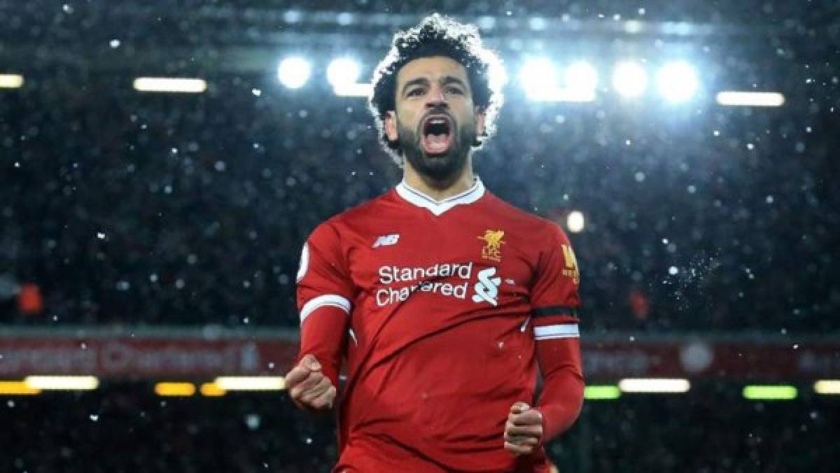 Liverpool's Egyptian midfielder Mohamed Salah celebrates scoring the fourth goal during the English Premier League football match between Liverpool and Watford at Anfield in Liverpool, north west England on March 17, 2018. / AFP PHOTO / Lindsey PARNABY / RESTRICTED TO EDITORIAL USE. No use with unauthorized audio, video, data, fixture lists, club/league logos or 'live' services. Online in-match use limited to 75 images, no video emulation. No use in betting, games or single club/league/player publications. /
