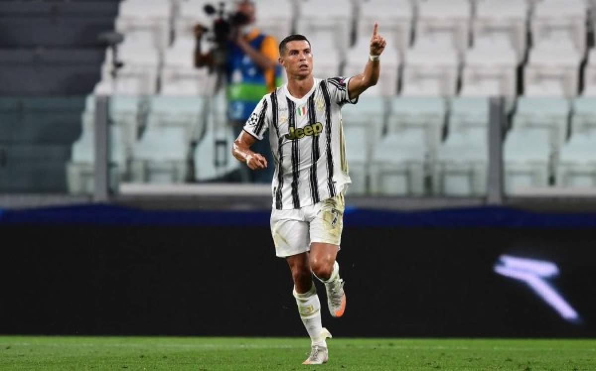 Juventus' Portuguese forward Cristiano Ronaldo celebrates scoring his team's first goal during the UEFA Champions League round of 16 second leg football match between Juventus and Olympique Lyonnais (OL), played behind closed doors due to the spread of the COVID-19 infection, caused by the novel coronavirus, at the Juventus stadium, in Turin , on August 7, 2020. (Photo by Miguel MEDINA / AFP)