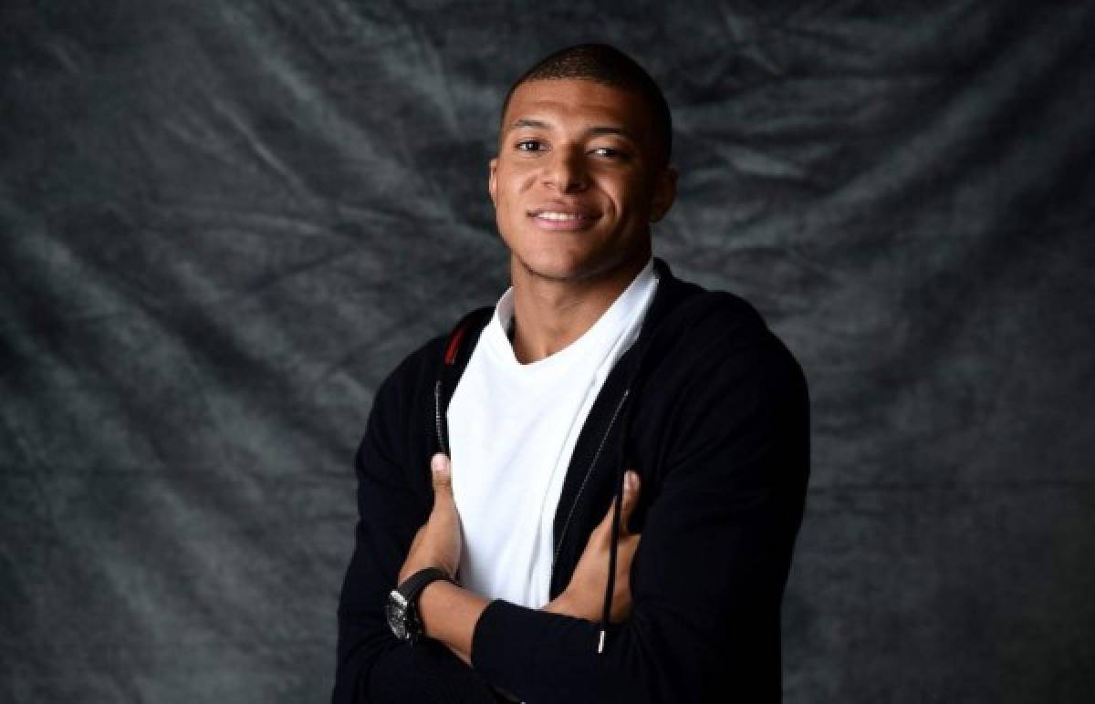 France's forward Kylian MBappe poses during a photo session after an interview with AFP in which he announced the formalization of his Ambassadorship with the Swiss luxury watchmaker Hublot on November 8, 2018. - Mbappe, who will turn 20 on December 20, became in the summer of 2017 the second most expensive player in football history with a move costing 180 million euros, behind his Brazilian teammate Neymar who's move cost 222 million euros (264 million US dollars). (Photo by FRANCK FIFE / AFP)