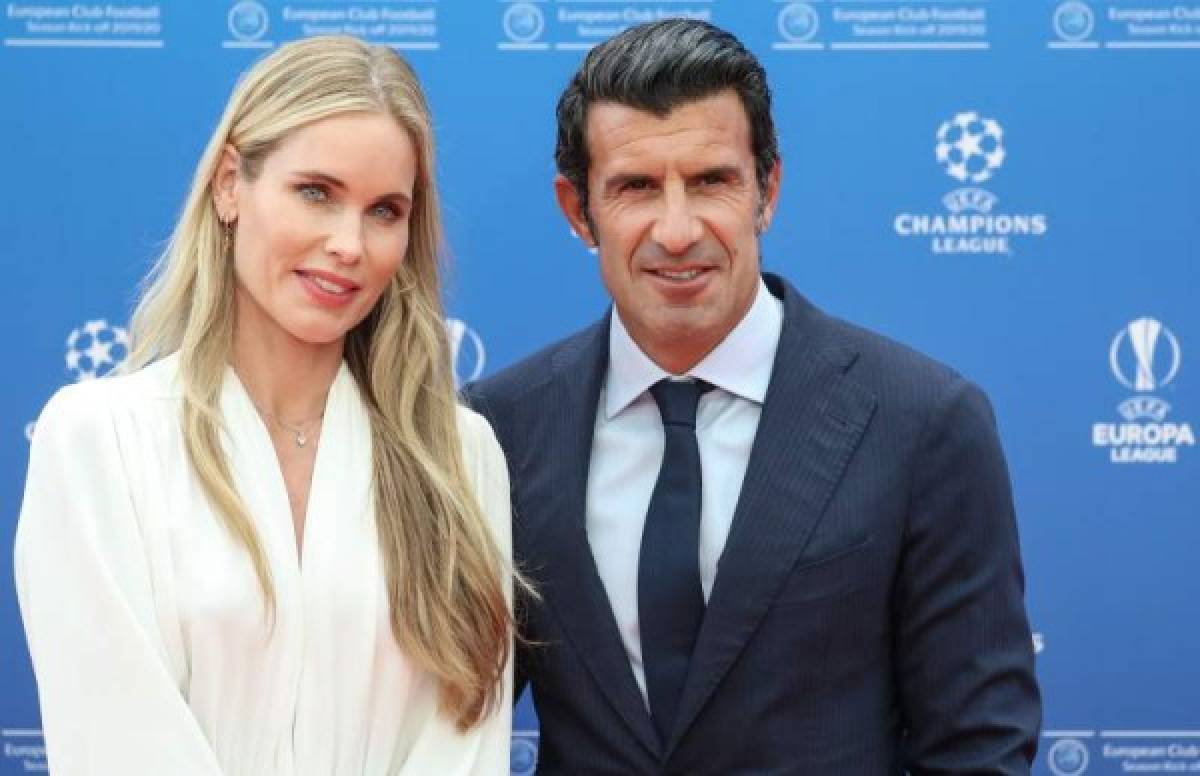 Retired Portuguese footballer Luis Figo (R) and his wife Helen Svedin pose as they arrive prior to the UEFA Champions League football group stage draw ceremony in Monaco on August 29, 2019. (Photo by Valery HACHE / AFP)