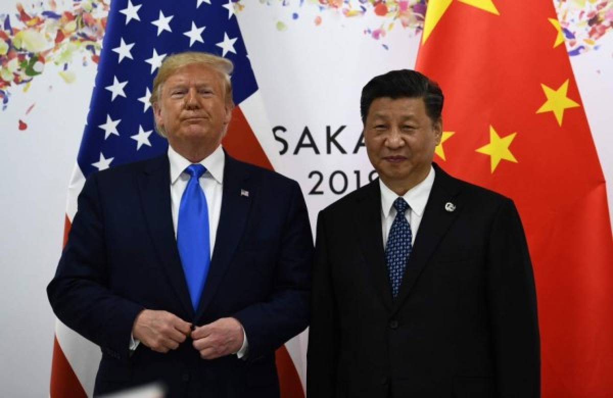(FILES) In this file photo taken on June 29, 2019, Chinese President Xi Jinping (R) and US President Donald Trump attend their bilateral meeting on the sidelines of the G20 Summit in Osaka. - Trump said on May 14, 2020, he does not wish to speak 'right now' to his Chinese counterpart Xi Jinping, declaring himself 'very disappointed' by the country's handling of the coronavirus pandemic. 'I have a very good relationship, but I just -- right now I don't want to speak to him,' Trump told Fox Business. Asked how the United States might choose to retaliate, Trump gave no specifics but struck a threatening tone, warning: 'There are many things we could do. We could do things. We could cut off the whole relationship.' (Photo by Brendan Smialowski / AFP)