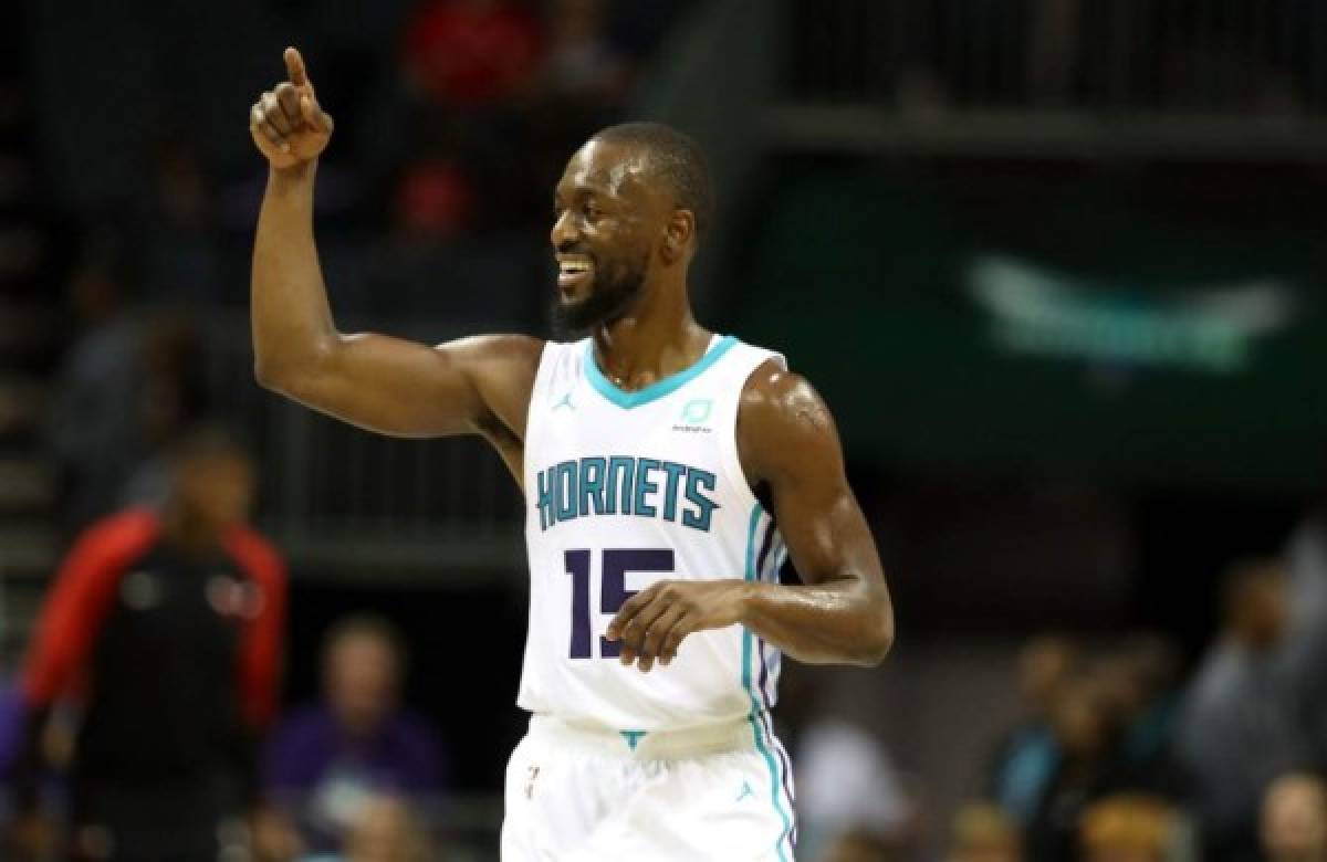 CHARLOTTE, NC - OCTOBER 08: Kemba Walker #15 of the Charlotte Hornets reacts after a play against the Chicago Bulls during their game at Spectrum Center on October 8, 2018 in Charlotte, North Carolina. NOTE TO USER: User expressly acknowledges and agrees that, by downloading and or using this photograph, User is consenting to the terms and conditions of the Getty Images License Agreement. Streeter Lecka/Getty Images/AFP