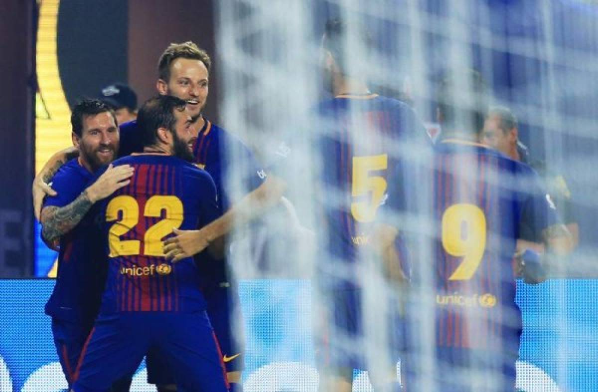 MIAMI GARDENS, FL - JULY 29: Lionel Messi #10 of Barcelona celebrates his goal with teammates in the first half against the Real Madrid during their International Champions Cup 2017 match at Hard Rock Stadium on July 29, 2017 in Miami Gardens, Florida. Chris Trotman/Getty Images/AFP== FOR NEWSPAPERS, INTERNET, TELCOS & TELEVISION USE ONLY ==
