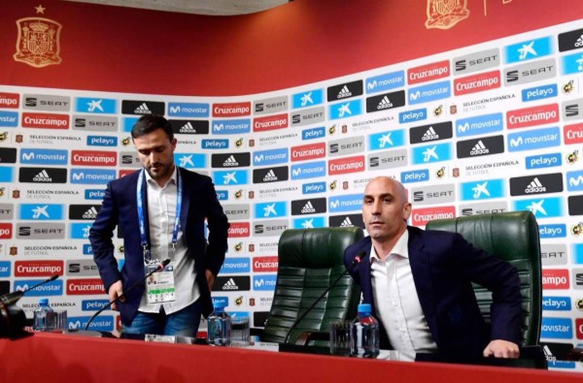 President of the Spanish Football Federation, Luis Rubiales (R), attends a press conference at Krasnodar Academy on June 13, 2018, ahead of the Russia 2018 World Cup football tournament.Spain sacked coach Lopetegui just two days before the team's opening game against Portugal at the World Cup, Spanish football federation chief Luis Rubiales confirmed on June 13, 2018. In a surprise announcement on June 12, Real Madrid named Lopetegui as their next manager to start work after the tournament in Russia, sparking outrage among the federation and Spanish fans at the timing of the announcement. / AFP PHOTO / PIERRE-PHILIPPE MARCOU