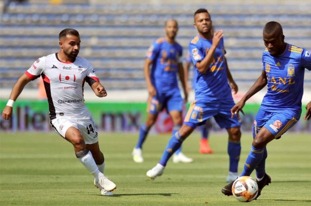 Lobos BUAP y Tigres están igualando en Liga MX. FOTO: AFP