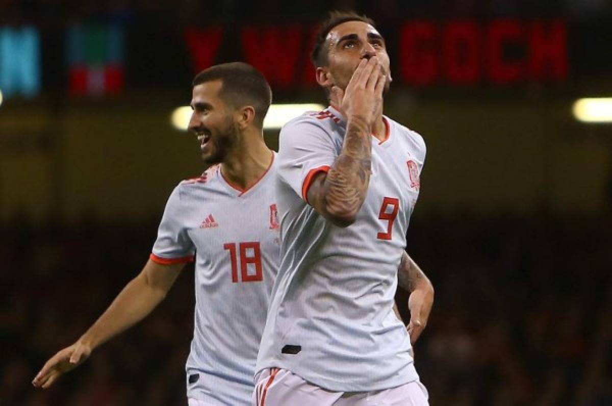 Spain's striker Paco Alcacer (R) celebrates scoring the opening goal during the international friendly football match between Wales and Spain at The Principality Stadium in Cardiff, south Wales, on October 11, 2018. (Photo by GEOFF CADDICK / AFP)