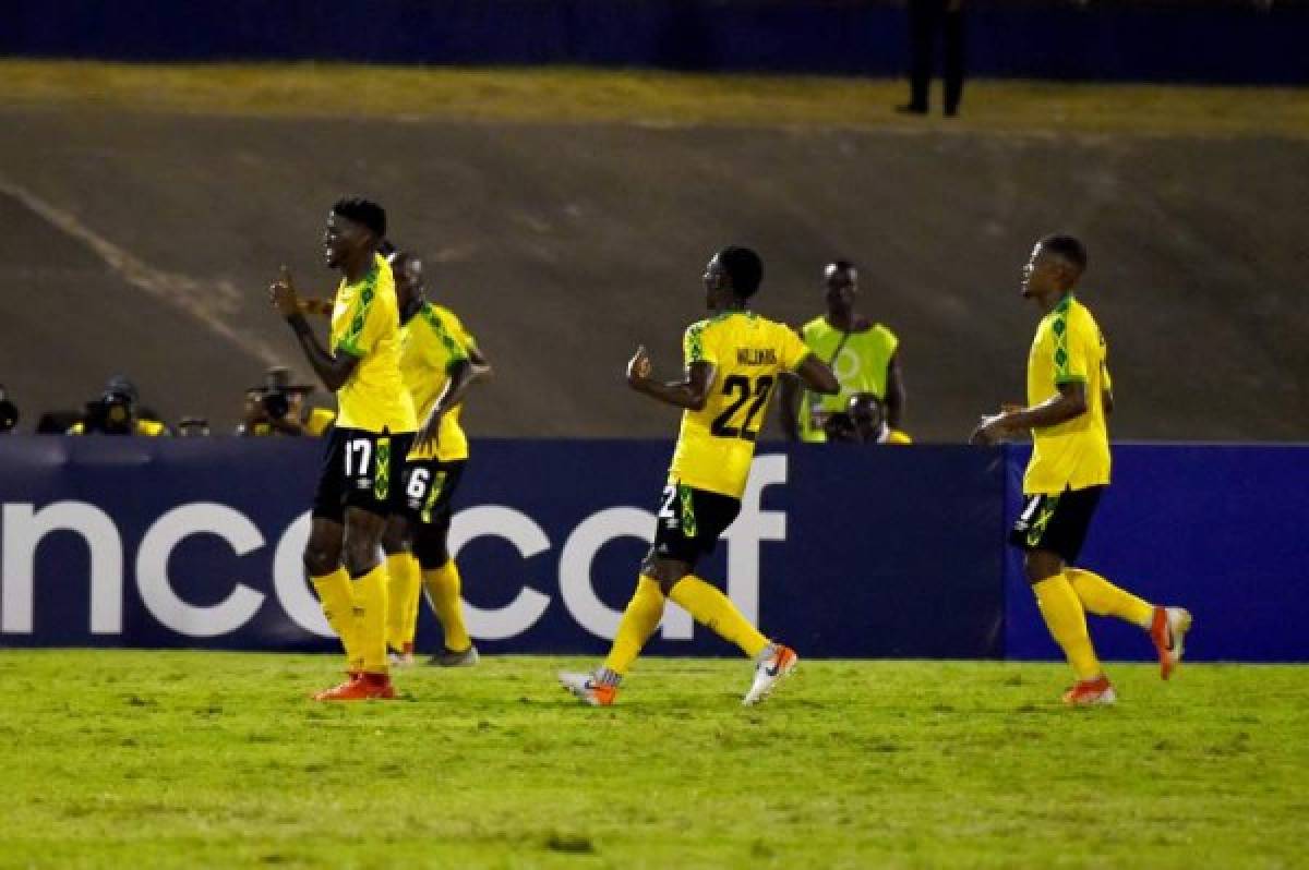 Jamaica's players (L-R) Damion Lowe, Dever Orgill, Devon Williams and Leon Bailey celebrate after scoring a goal during the 2019 Concacaf Gold Cup match between Jamaica and Honduras, on June 17, 2019 at Independence Park in Kingston. (Photo by CHANDAN KHANNA / AFP)