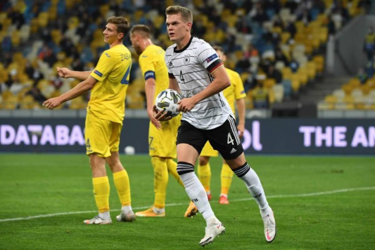 Germany's defender Matthias Ginter celebrates after scoring the opening goal during the UEFA Nations League football match between Ukraine and Germany at the Olympiyskiy stadium in Kiev on October 10, 2020. (Photo by Sergei SUPINSKY / AFP)
