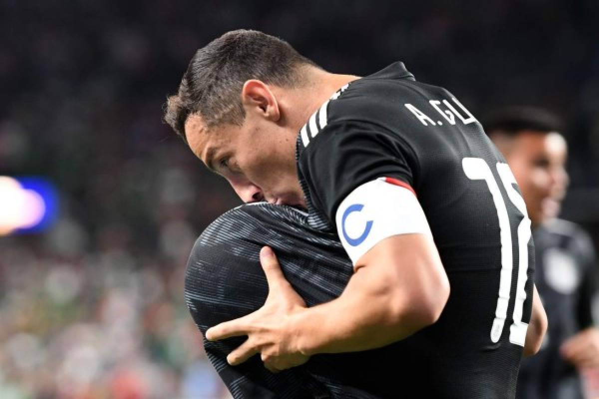 Mexico's midfielder Andres Guardado kisses the ball under his jersey as he celebrates after scoring a goal during the CONCACAF Gold Cup Group A match between Mexico and Canada on June 19, 2019 at Broncos Mile High stadium in Denver, Colorado. (Photo by Robyn Beck / AFP)