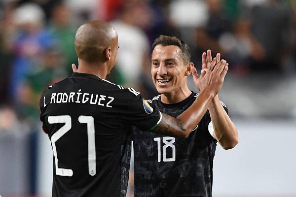 Mexico's defender Luis Alfonso Rodriguez (L) and Mexico's midfielder Andres Guardado celebrate after winning the CONCACAF Gold Cup Group A match against Canada on June 19, 2019 at Broncos Mile High stadium in Denver, Colorado. (Photo by Robyn Beck / AFP)