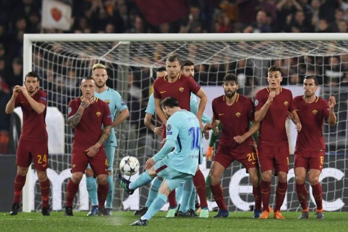 FC Barcelona's Argentinian forward Lionel Messi (C) shoots a free kick during the UEFA Champions League quarter-final second leg football match between AS Roma and FC Barcelona at the Olympic Stadium in Rome on April 10, 2018.FC Barcelona's Argentinian forward Lionel Messi (C) shoots a free kick / AFP PHOTO / LLUIS GENE