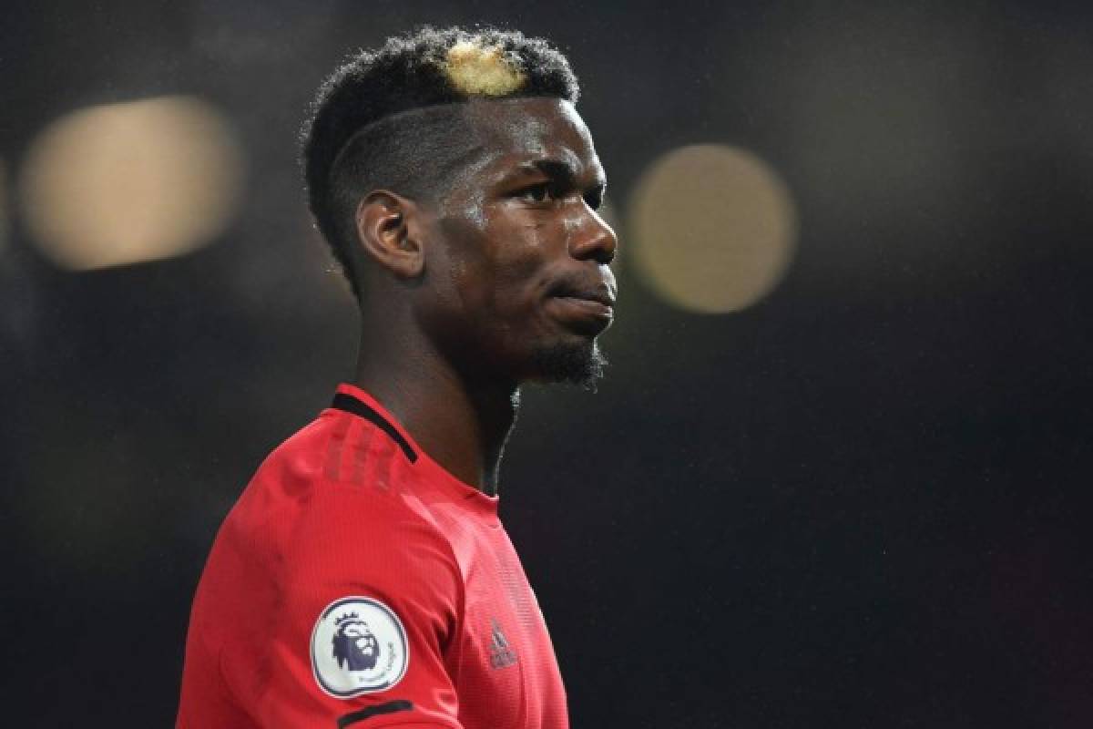 Manchester United's French midfielder Paul Pogba leaves the pitch after the English Premier League football match between Manchester United and Newcastle United at Old Trafford in Manchester, north west England, on December 26, 2019. - Manchester United won the game 4-1. (Photo by Paul ELLIS / AFP) / RESTRICTED TO EDITORIAL USE. No use with unauthorized audio, video, data, fixture lists, club/league logos or 'live' services. Online in-match use limited to 120 images. An additional 40 images may be used in extra time. No video emulation. Social media in-match use limited to 120 images. An additional 40 images may be used in extra time. No use in betting publications, games or single club/league/player publications. /