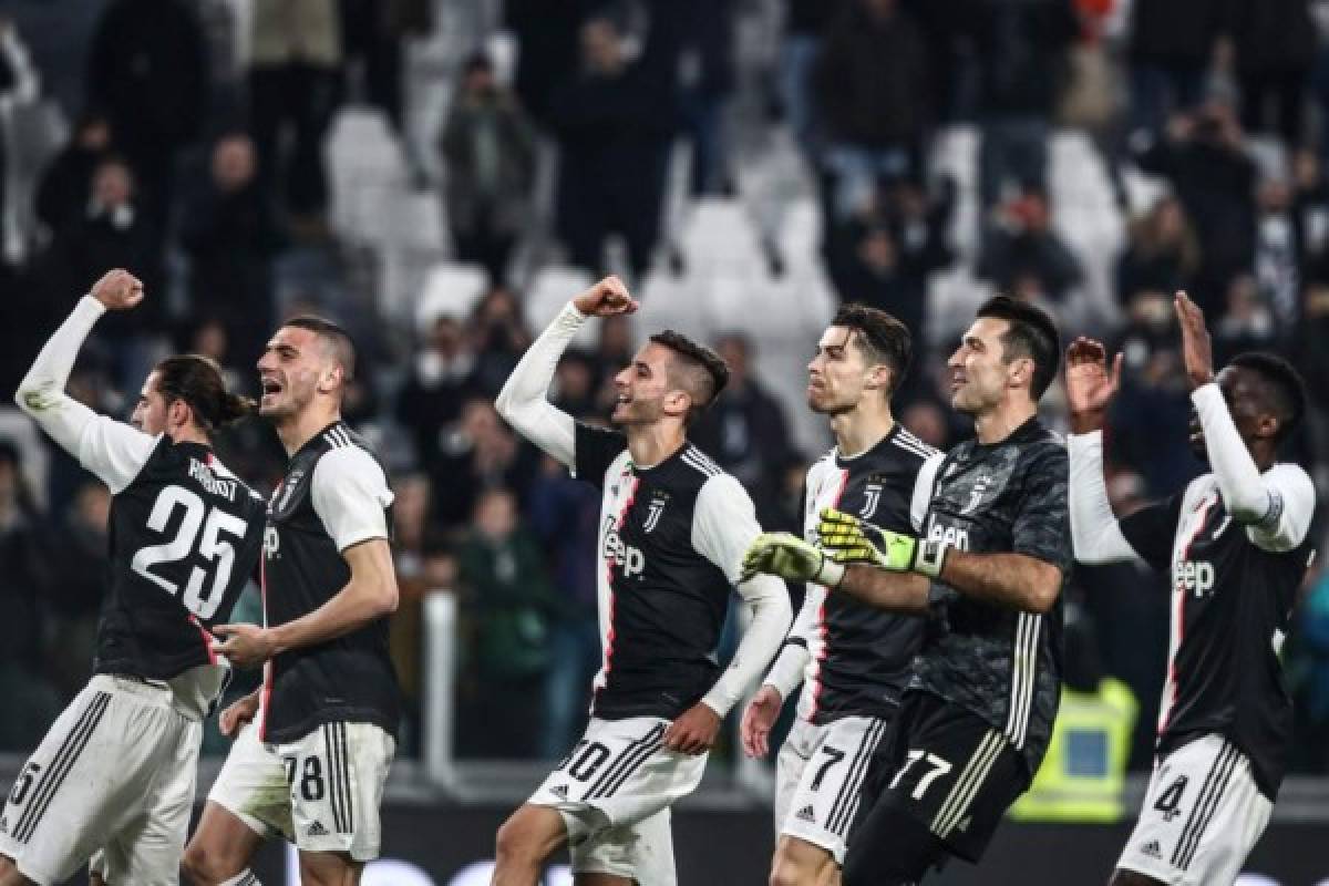 (From L) Juventus' French midfielder Adrien Rabiot, Juventus' Turkish defender Merih Demiral, Juventus' Uruguayan midfielder Rodrigo Bentancur, Juventus' Portuguese forward Cristiano Ronaldo, Juventus' Italian goalkeeper Gianluigi Buffon and Juventus' French midfielder Blaise Matuidi acknowledge the public at the end of the Italian Serie A football match Juventus vs Udinese on December 15, 2019 at the Juventus Allianz stadium in Turin. (Photo by Isabella BONOTTO / AFP)