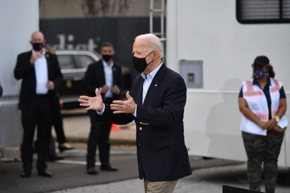 US President Joe Biden gestures after speaking during a visit to a FEMA Covid-19 vaccination facility at NRG Stadium in Houston, Texas on February 26, 2021. (Photo by MANDEL NGAN / AFP)