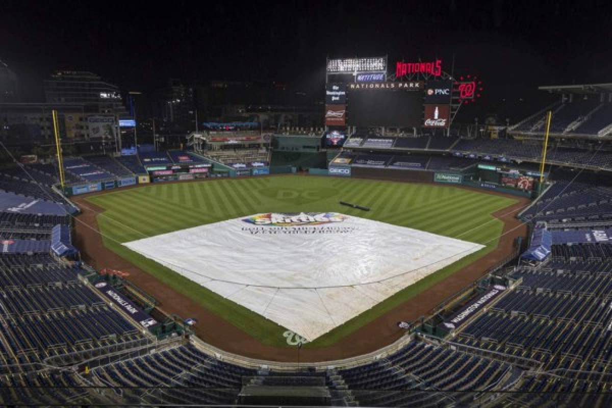 WASHINGTON, DC - JULY 21: A general view of the Skittles tarp over the infield after the game between the Washington Nationals and the Baltimore Orioles was called due to inclement weather during the eighth inning at Nationals Park on July 21, 2020 in Washington, DC. Scott Taetsch/Getty Images/AFP
