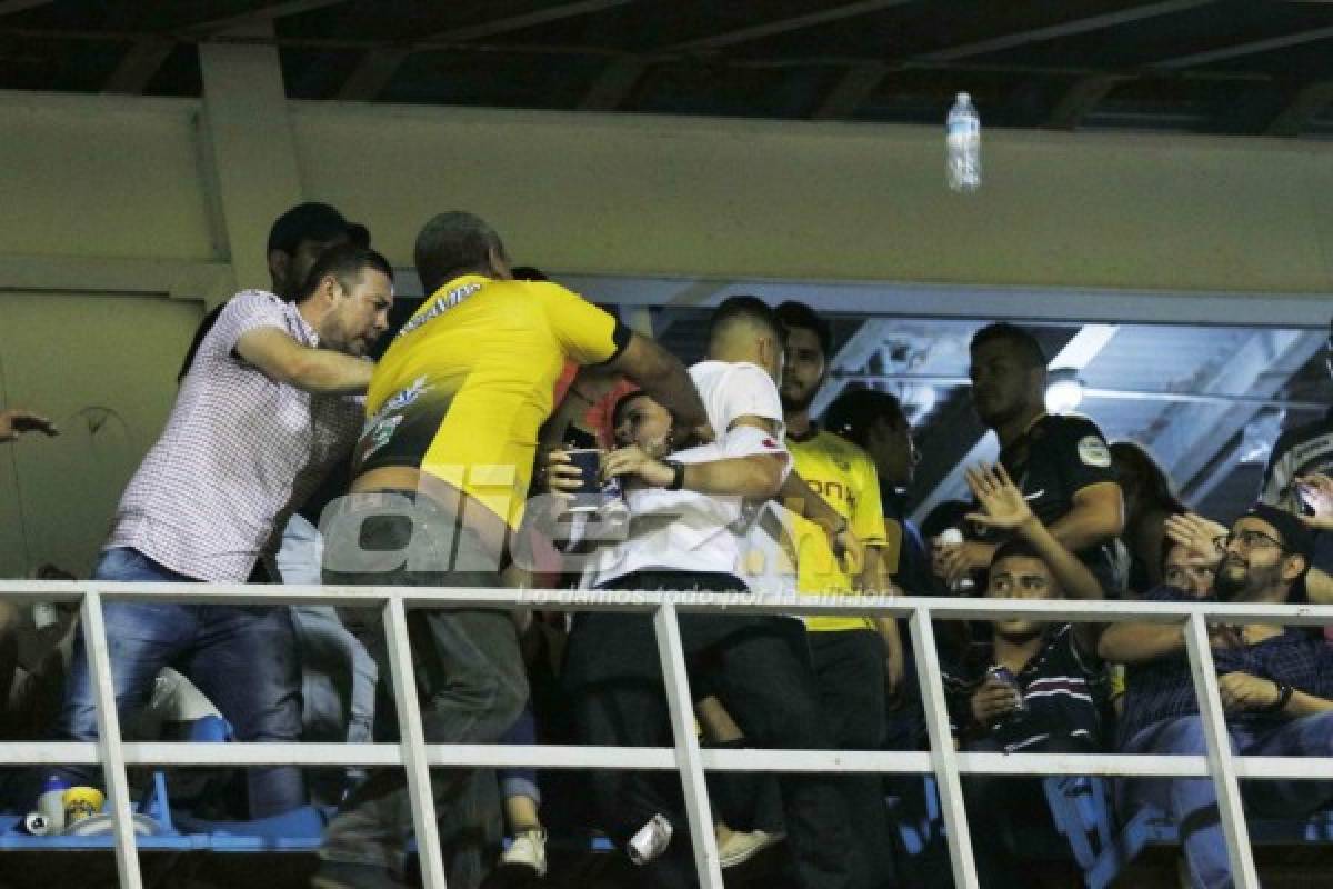 En fotos: Así fue la pelea entre aficionado del Olimpia y Real España en el palco