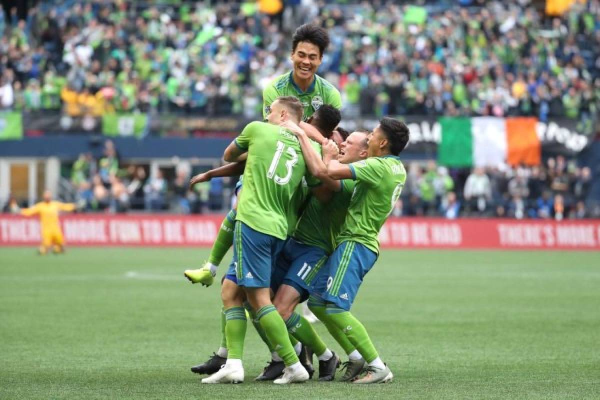 SEATTLE, WASHINGTON - NOVEMBER 10: The Seattle Sounders celebrate a goal by Kelvin Leerdam #18 of the Seattle Sounders to take a 1-0 lead against Toronto FC in the second half during the 2019 MLS Cup at CenturyLink Field on November 10, 2019 in Seattle, Washington. Abbie Parr/Getty Images/AFP