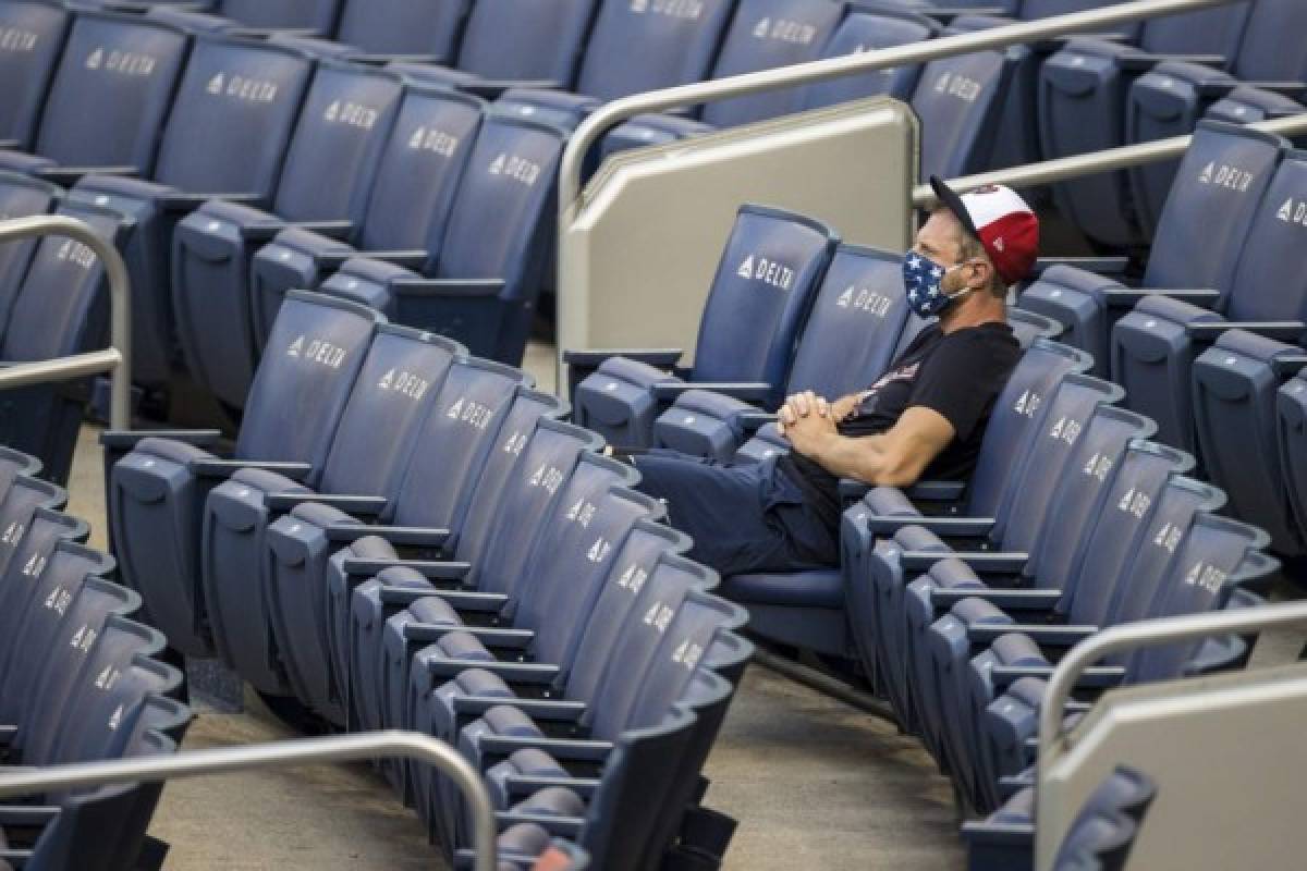 WASHINGTON, DC - JULY 21: Max Scherzer #31 of the Washington Nationals watches the game from an empty seat during the second inning of the game against the Baltimore Orioles at Nationals Park on July 21, 2020 in Washington, DC. Scott Taetsch/Getty Images/AFP