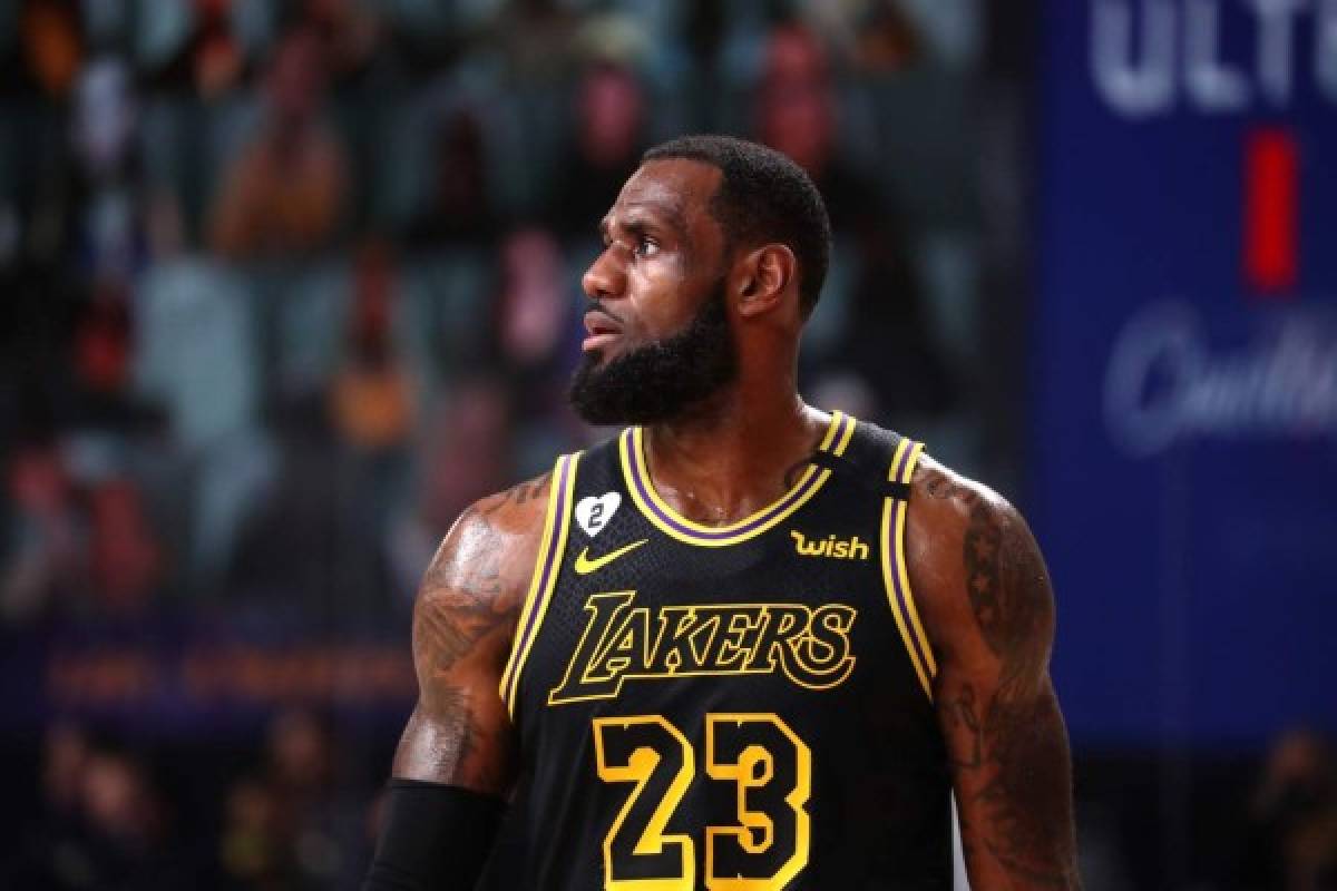ORLANDO, FL - OCTOBER 9: LeBron James #23 of the Los Angeles Lakers looks on during Game Five of the NBA Finals on October 9, 2020 at AdventHealth Arena in Orlando, Florida. NOTE TO USER: User expressly acknowledges and agrees that, by downloading and/or using this Photograph, user is consenting to the terms and conditions of the Getty Images License Agreement. Mandatory Copyright Notice: Copyright 2020 NBAE Nathaniel S. Butler/NBAE via Getty Images/AFP
