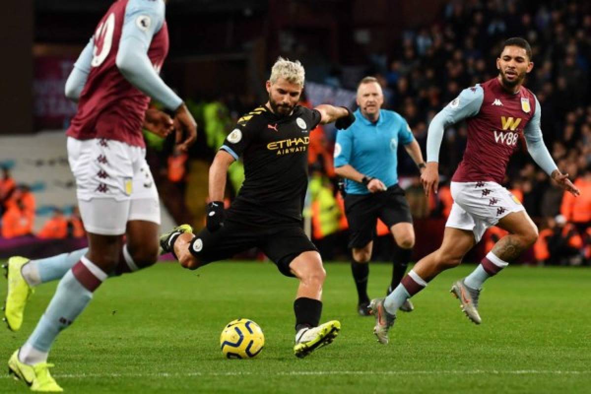 Manchester City's Argentinian striker Sergio Aguero shoots to score their third goal during the English Premier League football match between Aston Villa and Manchester City at Villa Park in Birmingham, central England on January 12, 2020. (Photo by Paul ELLIS / AFP) / RESTRICTED TO EDITORIAL USE. No use with unauthorized audio, video, data, fixture lists, club/league logos or 'live' services. Online in-match use limited to 120 images. An additional 40 images may be used in extra time. No video emulation. Social media in-match use limited to 120 images. An additional 40 images may be used in extra time. No use in betting publications, games or single club/league/player publications. /