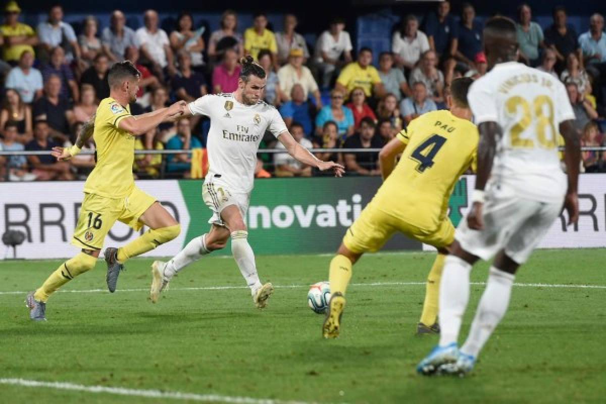 Real Madrid's Welsh forward Gareth Bale (2L) scores a goal during the Spanish league football match Villarreal CF against Real Madrid CF at La Ceramica stadium in Vila-real on September 1, 2019. (Photo by Josep LAGO / AFP)