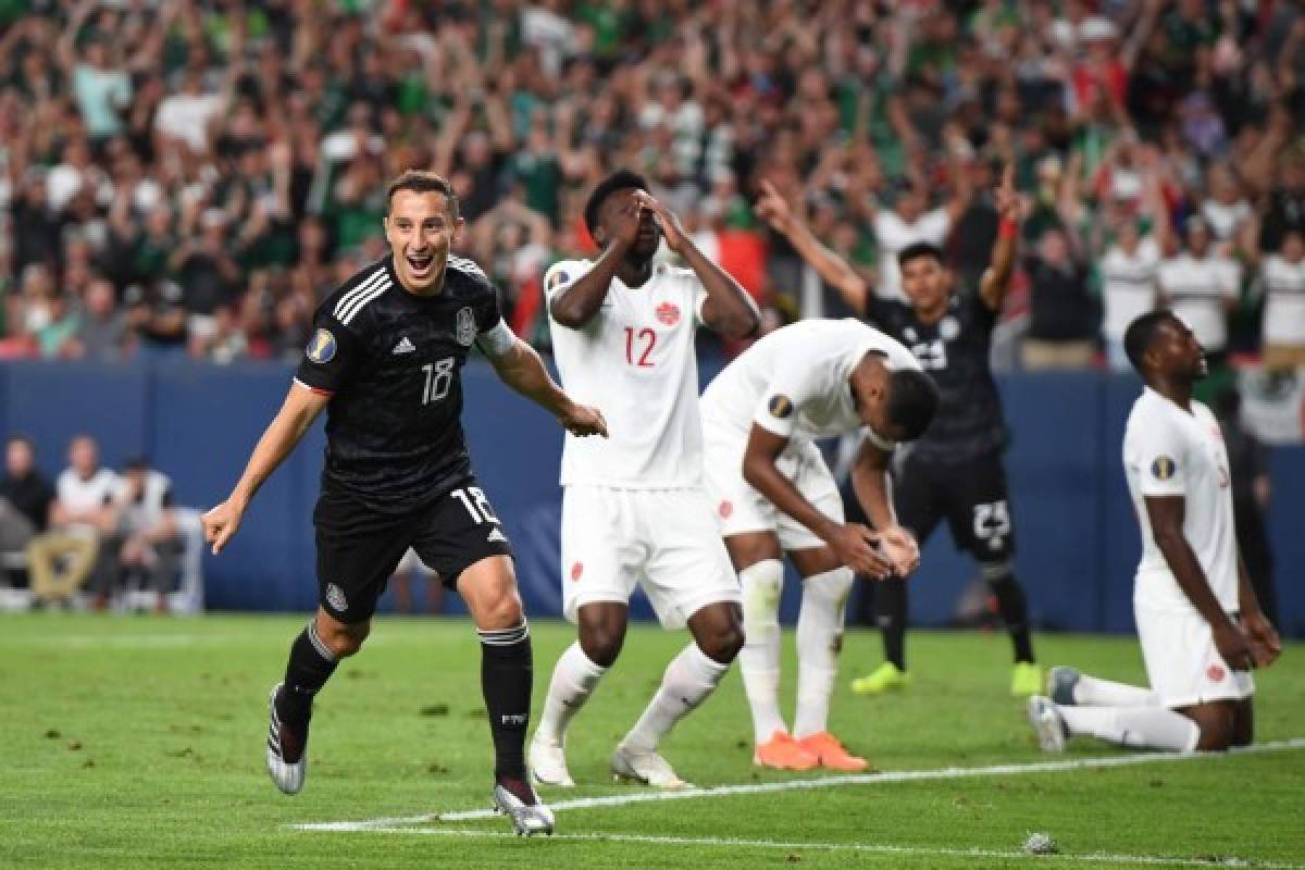 Mexico's midfielder Andres Guardado (L) celebrates after scoring a goal during the CONCACAF Gold Cup Group A match between Mexico and Canada on June 19, 2019 at Broncos Mile High stadium in Denver, Colorado. (Photo by Robyn Beck / AFP)