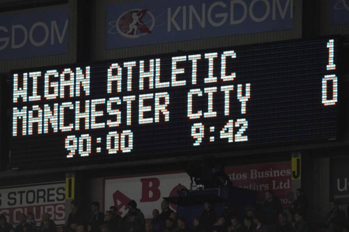 Scoreboard flashes during the English FA Cup fifth round football match between Wigan Athletic and Manchester City at the DW Stadium in Wigan, northwest England, on February 19, 2018. / AFP PHOTO / Oli SCARFF / RESTRICTED TO EDITORIAL USE. No use with unauthorized audio, video, data, fixture lists, club/league logos or 'live' services. Online in-match use limited to 75 images, no video emulation. No use in betting, games or single club/league/player publications. /