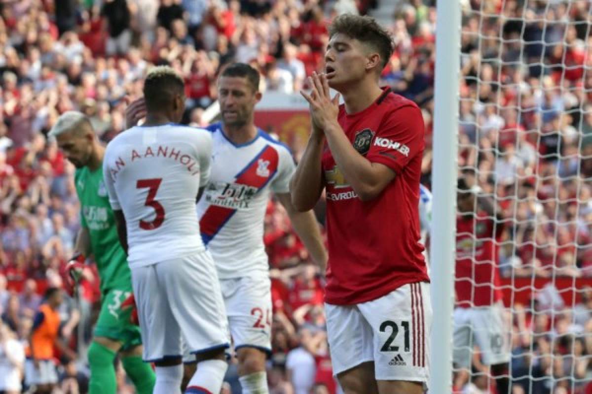 Manchester United's Welsh midfielder Daniel James (R) reacts to a missed chance during the English Premier League football match between Manchester United and Crystal Palace at Old Trafford in Manchester, north west England, on August 24, 2019. - Crystal Palace won the game 2-1. (Photo by Lindsey Parnaby / AFP) / RESTRICTED TO EDITORIAL USE. No use with unauthorized audio, video, data, fixture lists, club/league logos or 'live' services. Online in-match use limited to 120 images. An additional 40 images may be used in extra time. No video emulation. Social media in-match use limited to 120 images. An additional 40 images may be used in extra time. No use in betting publications, games or single club/league/player publications. /