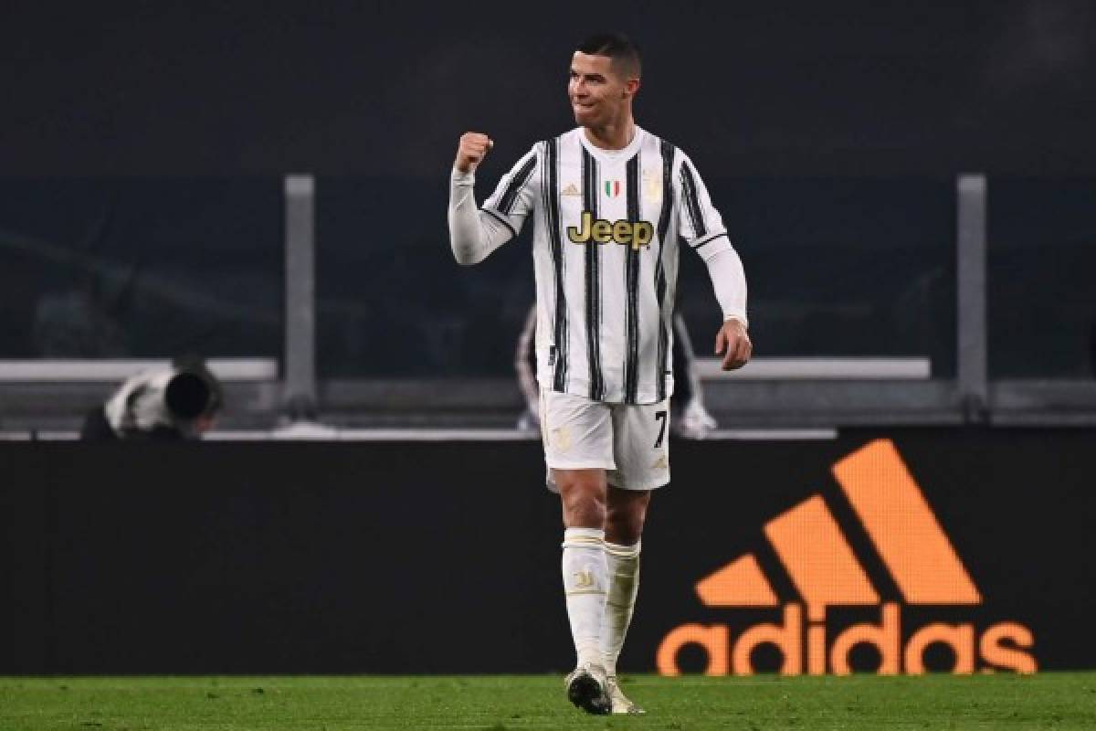 Juventus' Portuguese forward Cristiano Ronaldo celebrates after scoring his second goal during the Italian Serie A football match Juventus vs Udinese on January 3, 2021 at the Juventus stadium in Turin. (Photo by Marco BERTORELLO / AFP)