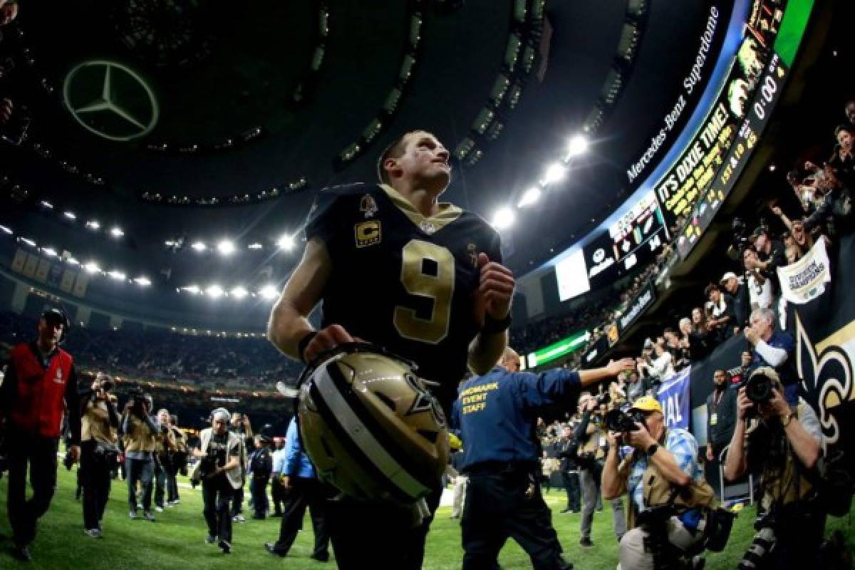 NEW ORLEANS, LOUISIANA - JANUARY 13: Drew Brees #9 of the New Orleans Saints runs off the field after his teams win over the Philadelphia Eagles in the NFC Divisional Playoff Game at Mercedes Benz Superdome on January 13, 2019 in New Orleans, Louisiana. The Saints defeated the Eagles 20-14. Sean Gardner/Getty Images/AFP