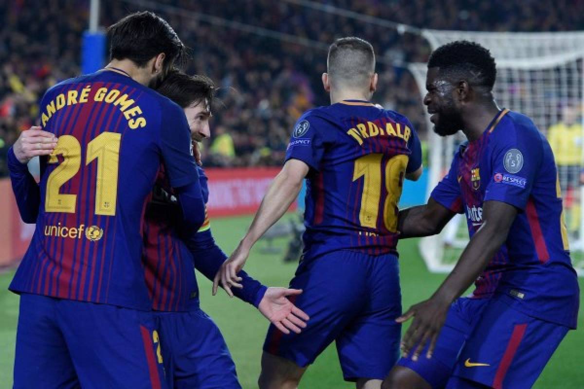 Barcelona's Argentinian forward Lionel Messi (2nd-L) celebrates with Barcelona's Portuguese midfielder Andre Gomes (L), Barcelona's French defender Samuel Umtiti (R) and Barcelona's Spanish defender Jordi Alba after scoring his team's third goal during the UEFA Champions League round of sixteen second leg football match between FC Barcelona and Chelsea FC at the Camp Nou stadium in Barcelona on March 14, 2018. / AFP PHOTO / LLUIS GENE