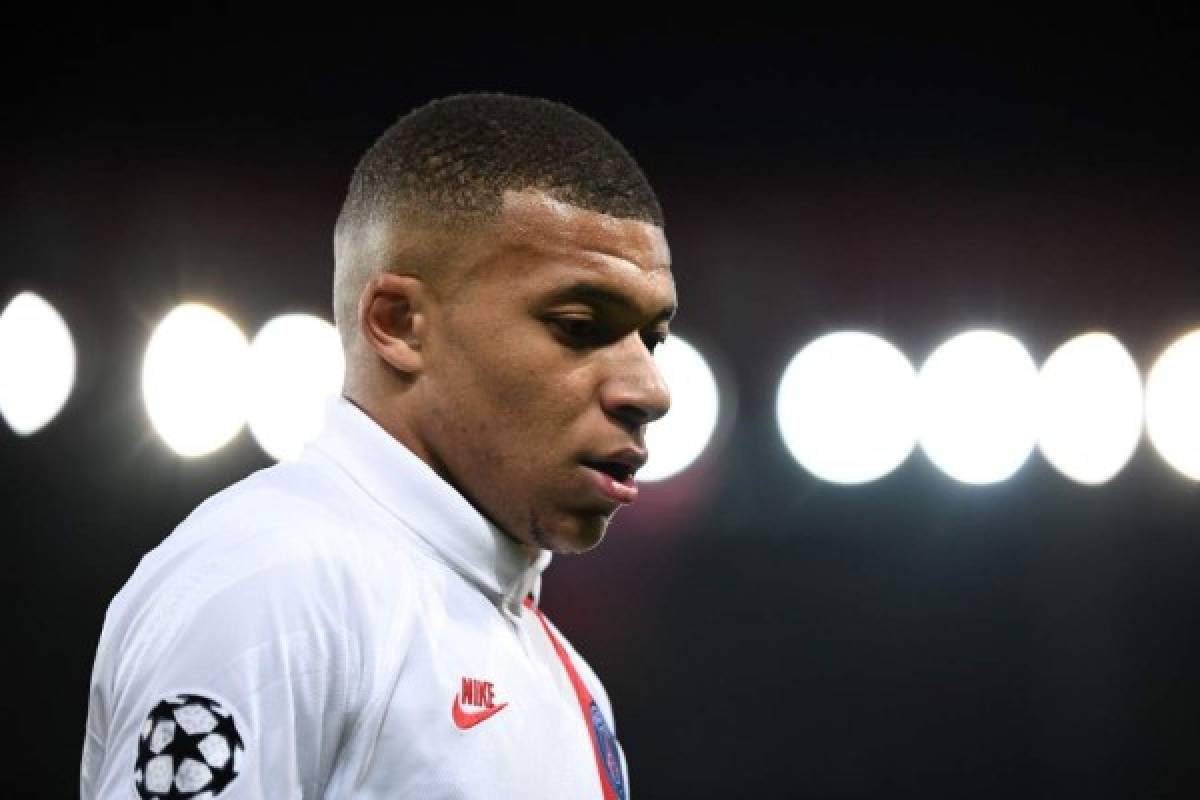 Paris Saint-Germain's French forward Kylian Mbappe looks down during the UEFA Champions League Group A football match between Paris Saint-Germain (PSG) and Club Brugge at the Parc des Princes stadium in Paris on November 6, 2019. (Photo by FRANCK FIFE / AFP)