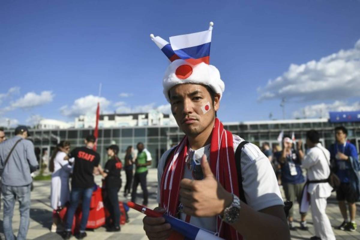 Dos culturas diferentes, una sola pasión: Hinchas de Senegal y Japón engalanaron el partido