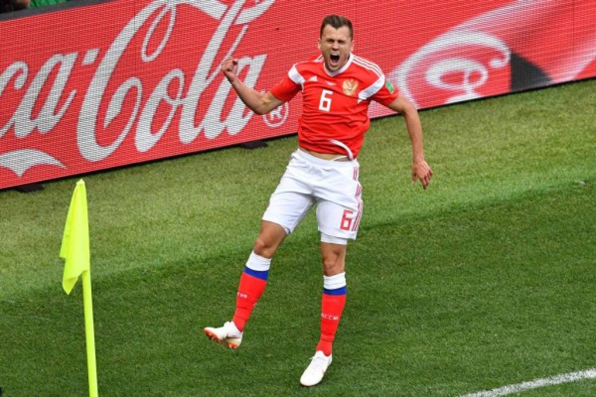 Russia's midfielder Denis Cheryshev celebrates his goal during the Russia 2018 World Cup Group A football match between Russia and Saudi Arabia at the Luzhniki Stadium in Moscow on June 14, 2018. / AFP PHOTO / Mladen ANTONOV / RESTRICTED TO EDITORIAL USE - NO MOBILE PUSH ALERTS/DOWNLOADS