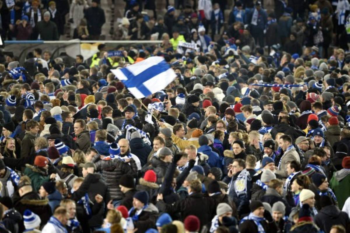 Fans celebrate the victory after the UEFA Euro 2020 Group J qualification football match between Finland and Liechtenstein in Helsinki, Finland, on November 15, 2019. (Photo by Martti Kainulainen / Lehtikuva / AFP) / Finland OUT