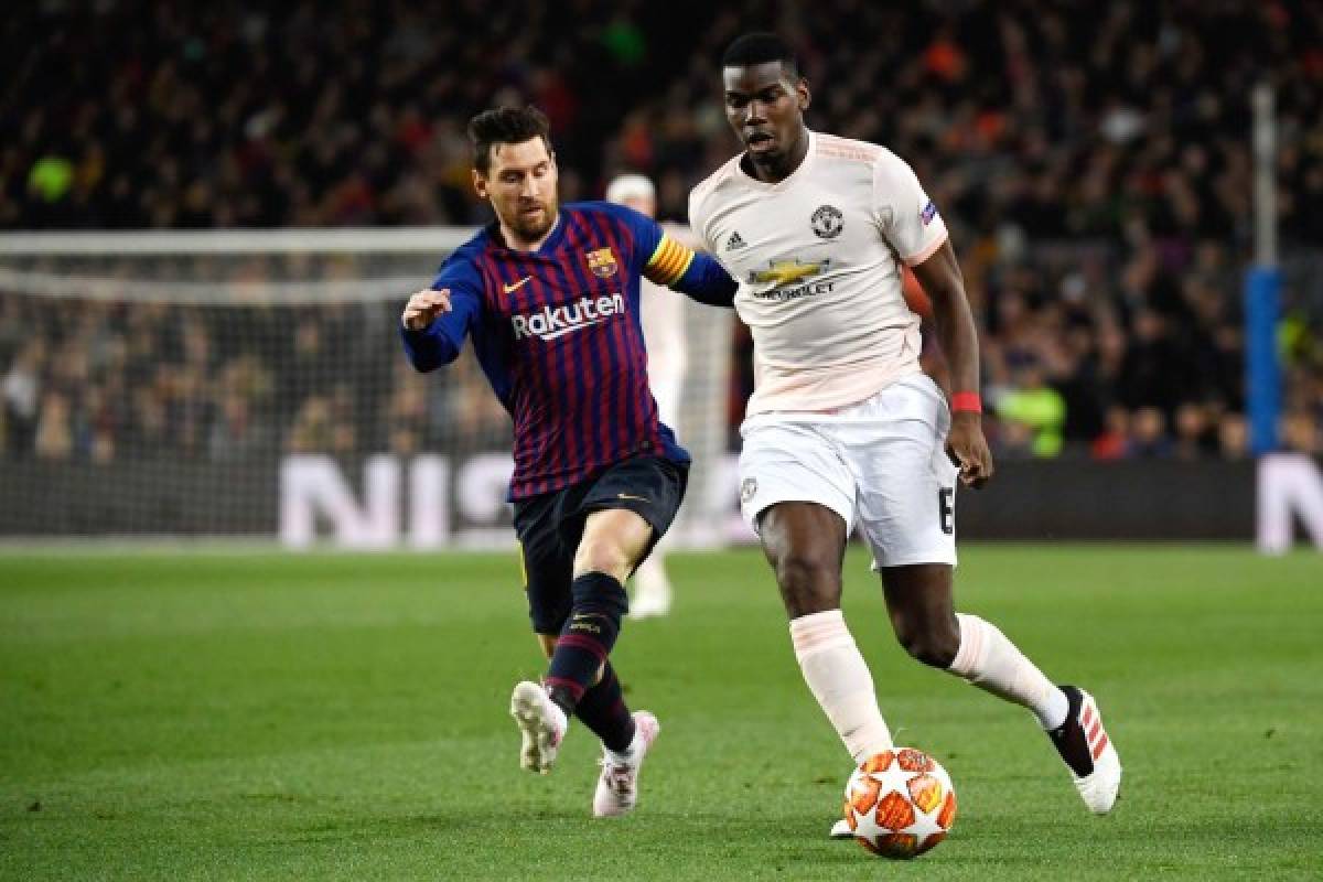 Barcelona's Argentinian forward Lionel Messi (L) vies with Manchester United's French midfielder Paul Pogba during the UEFA Champions League quarter-final second leg football match between Barcelona and Manchester United at the Camp Nou stadium in Barcelona on April 16, 2019. (Photo by LLUIS GENE / AFP)