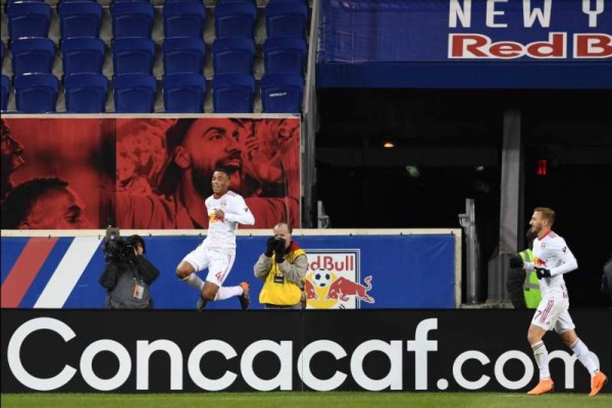 New York Red Bulls' Tyler Adams (L) celebrates during the Concacaf Champions League 2nd Leg Quarter-final football match between the New York Red Bulls and Club Tijuana at the Red Bull Arena in Harrison, New Jersey on March 13, 2018. / AFP PHOTO / Don Emmert