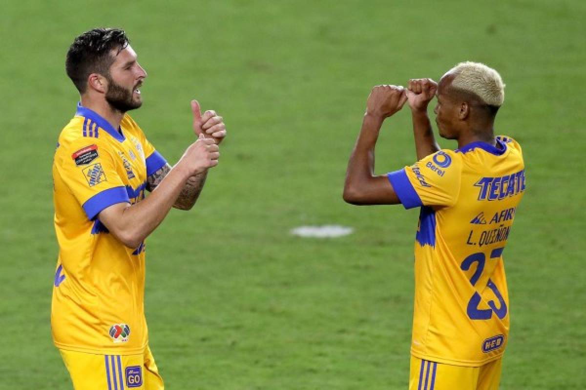 ORLANDO, FL - DECEMBER 19: Andre-Pierre Gignac #10 of Tigres UANL celebrates a goal with Luis Quinones #23 during the CONCACAF Champions League semifinal game against CD Olimpia at Exploria Stadium on December 19, 2020 in Orlando, Florida. Alex Menendez/Getty Images/AFP== FOR NEWSPAPERS, INTERNET, TELCOS & TELEVISION USE ONLY ==