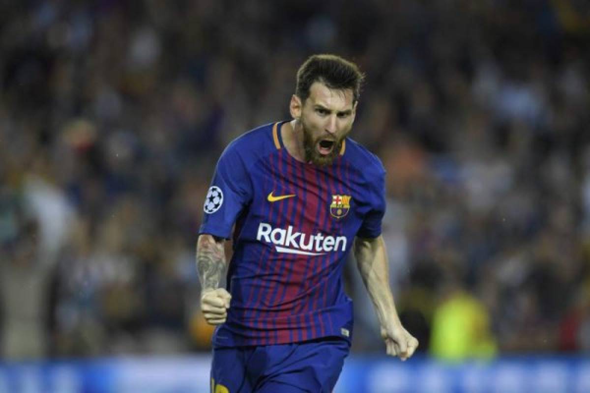 Barcelona's forward from Argentina Lionel Messi celebrates after scoring during the UEFA Champions League Group D football match FC Barcelona vs Juventus at the Camp Nou stadium in Barcelona on September 12, 2017. / AFP PHOTO / LLUIS GENE