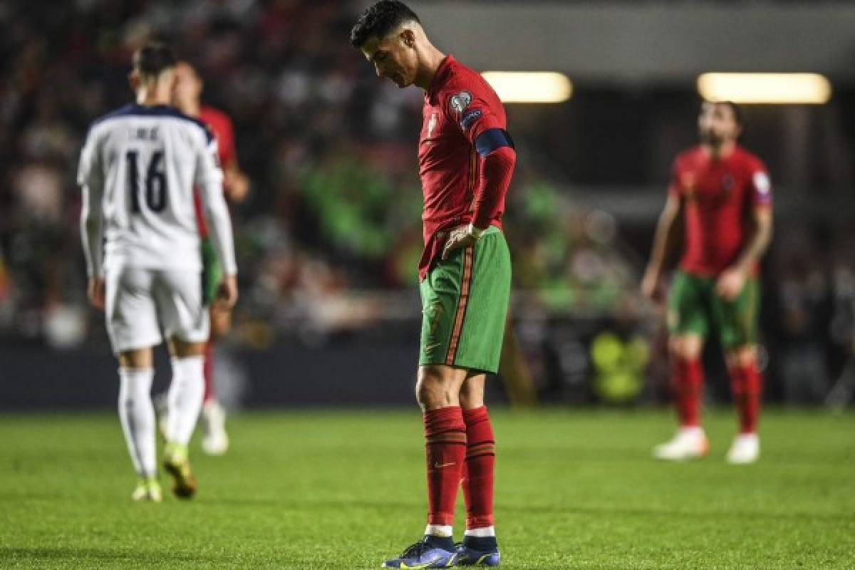 Portugal's forward Cristiano Ronaldo reacts at the end of the FIFA World Cup Qatar 2022 qualification group A football match between Portugal and Serbia, at the Luz stadium in Lisbon, on November 14, 2021. (Photo by PATRICIA DE MELO MOREIRA / AFP)