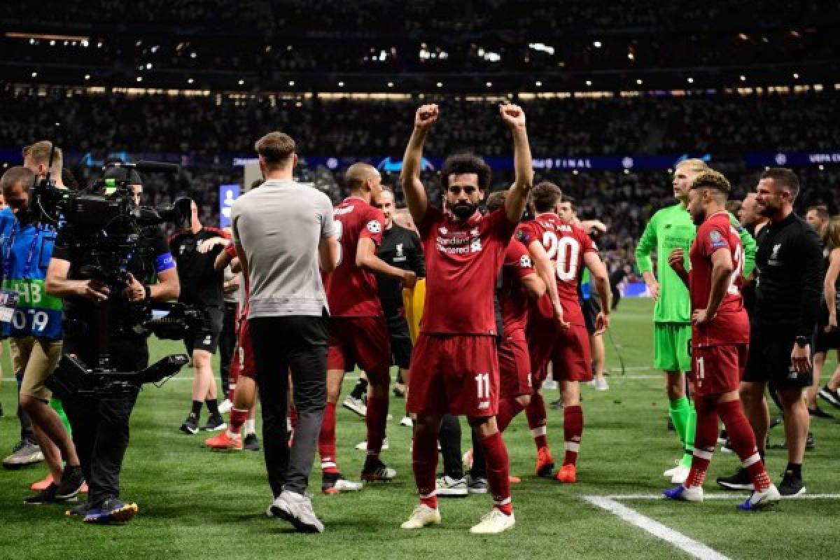 Liverpool's Egyptian midfielder Mohamed Salah celebrates after winning the UEFA Champions League final football match between Liverpool and Tottenham Hotspur at the Wanda Metropolitano Stadium in Madrid on June 1, 2019. (Photo by JAVIER SORIANO / AFP)
