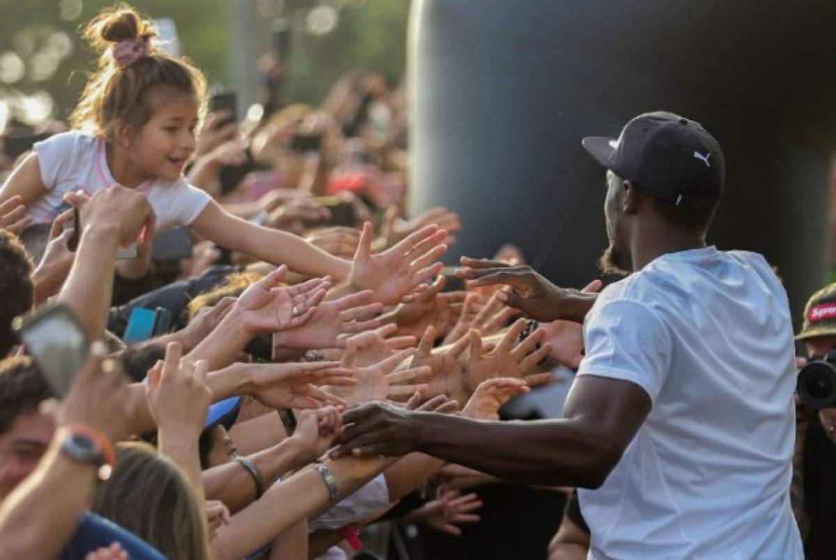 Las mejores imagenes de la carrera entre Usain Bolt y una Mototaxi