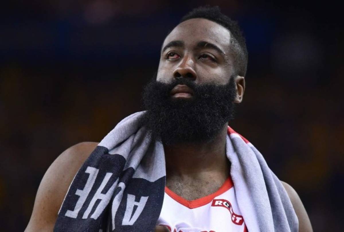 OAKLAND, CA - APRIL 30: James Harden #13 of the Houston Rockets walks back onto the court after he was poked in the left eye by Draymond Green #23 of the Golden State Warriors in Game Two of the Second Round of the 2019 NBA Western Conference Playoffs at ORACLE Arena on April 30, 2019 in Oakland, California. NOTE TO USER: User expressly acknowledges and agrees that, by downloading and or using this photograph, User is consenting to the terms and conditions of the Getty Images License Agreement. Thearon W. Henderson/Getty Images/AFP