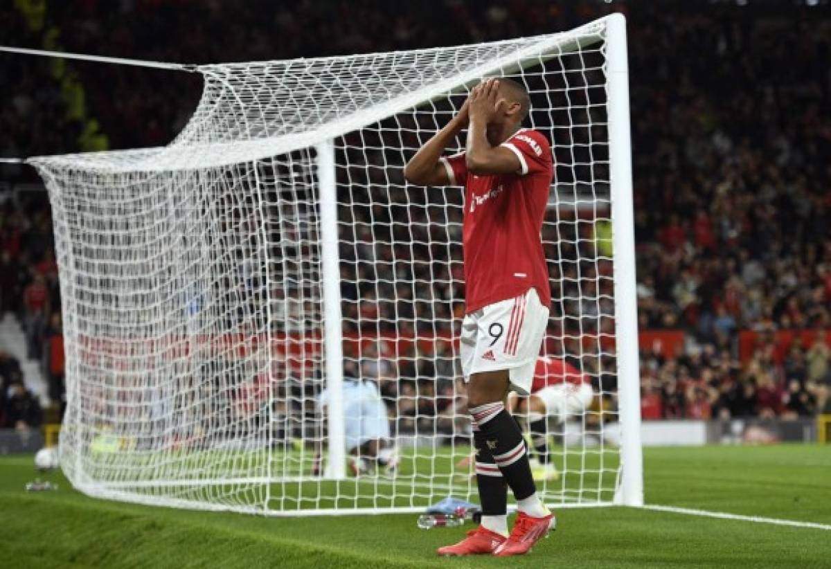 Manchester United's French striker Anthony Martial reacts after failing to score during the English League Cup third round football match between Manchester United and West Ham United at Old Trafford in Manchester, north west England, on September 22, 2021. (Photo by Oli SCARFF / AFP) / RESTRICTED TO EDITORIAL USE. No use with unauthorized audio, video, data, fixture lists, club/league logos or 'live' services. Online in-match use limited to 120 images. An additional 40 images may be used in extra time. No video emulation. Social media in-match use limited to 120 images. An additional 40 images may be used in extra time. No use in betting publications, games or single club/league/player publications. /