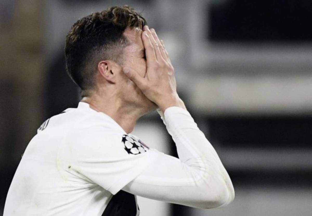 Juventus' Portuguese forward Cristiano Ronaldo reacts after missing a goal opportunity during the UEFA Champions League quarter-final second leg football match Juventus vs Ajax Amsterdam on April 16, 2019 at the Juventus stadium in Turin. (Photo by Filippo MONTEFORTE / AFP)