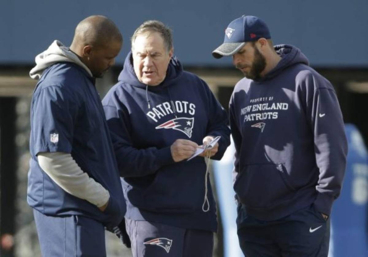 New England Patriots head coach Bill Belichick, center, speaks with linebackers coach Brian Flores, left, and defensive line coach Brendan Daly, right, during an NFL football team practice, Thursday, Jan. 19, 2017, in Foxborough, Mass. The Patriots host the Pittsburgh Steelers in the AFC championship game Sunday. (AP Photo/Steven Senne)